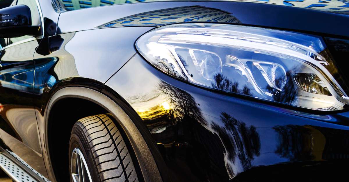 alt="Closeup of a clean black car"