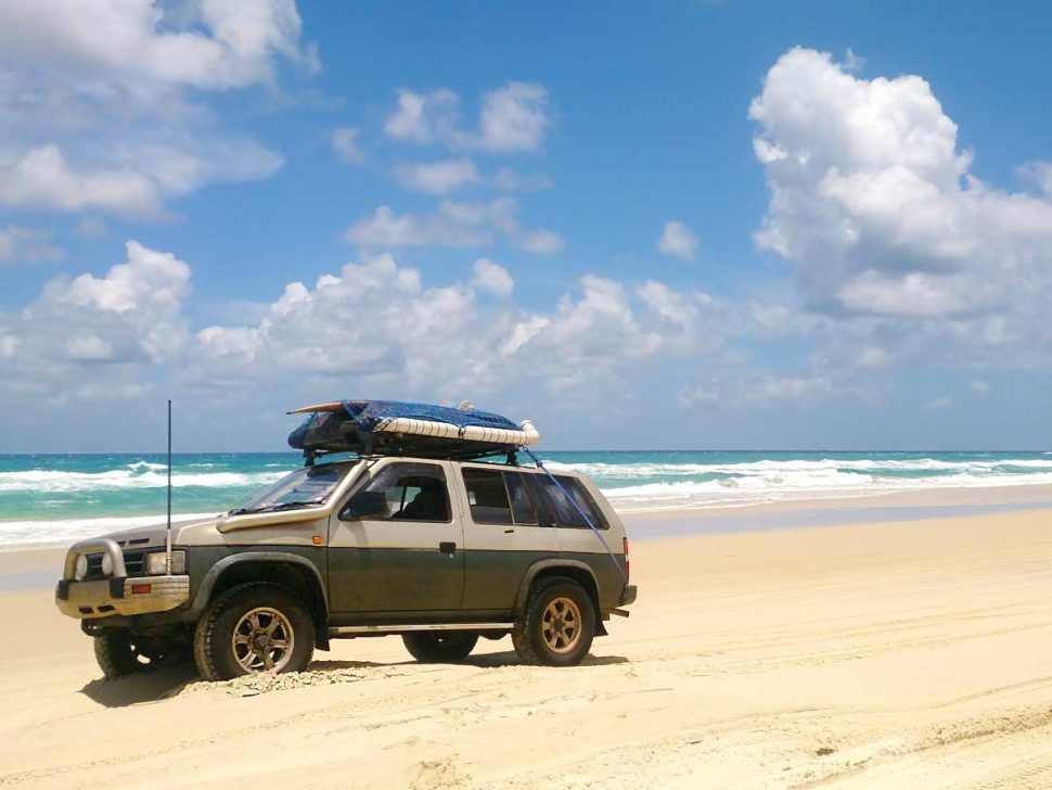 4WD parked along a beautiful beach