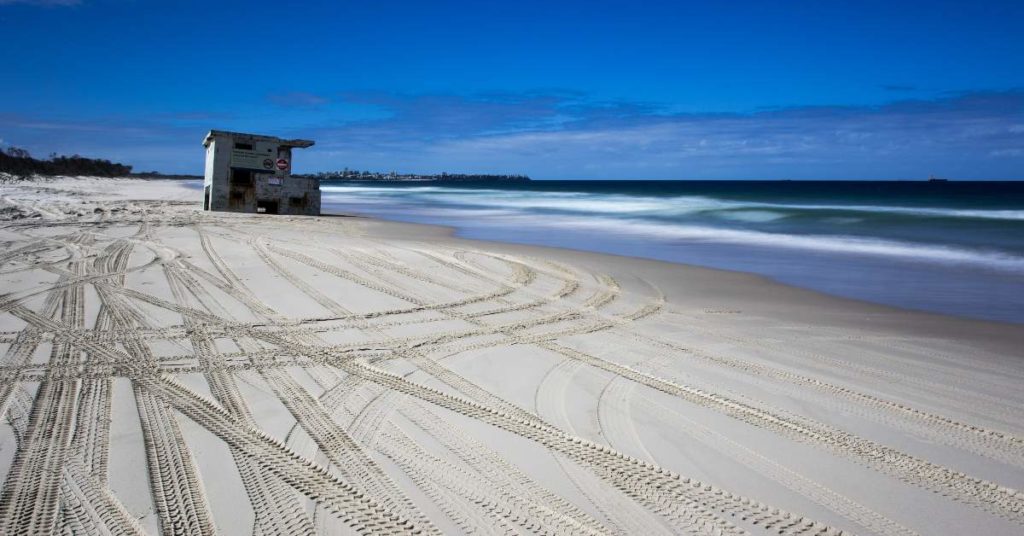 Car prints in the sand at Bribie Island 
