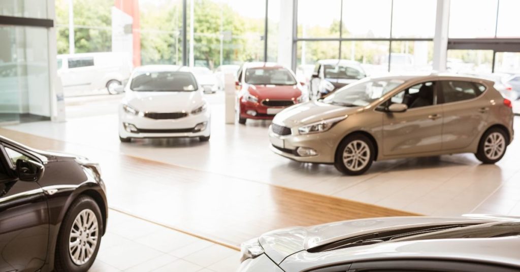 Several cars in a showroom 