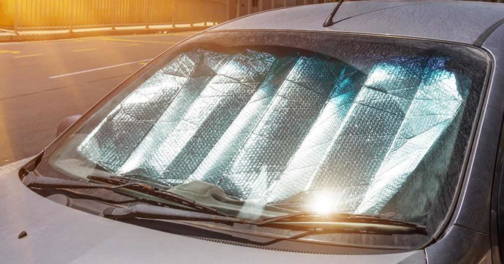 Car using a reflective sun shade