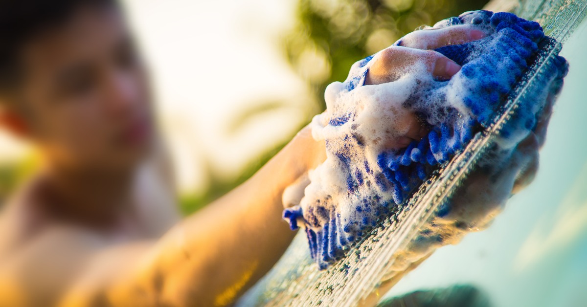 Close up of sponge cleaning car 