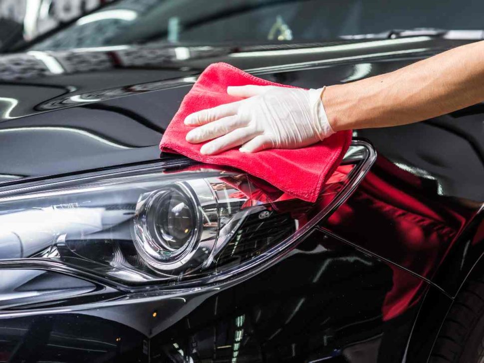 Smooth and sleek hood of a polished black car