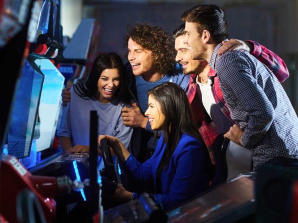 Friends having fun at an arcade